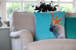 Vibrant cockatoo cushion with plush velvet texture and colorful feather design, perfect for adding a touch of tropical flair to any living space.