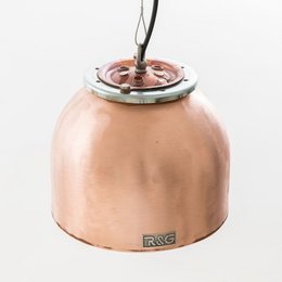 Copper hanging lamp with a round, flange-like shape. Suitable for pendant lighting in modern or industrial-style interiors.