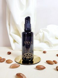 Precious Argan and Organic Neroli Duo, a cream product in a dark glass bottle with a black cap and gold floral design.