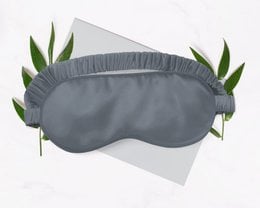 Grey silk sleep mask with soft, comfortable design.