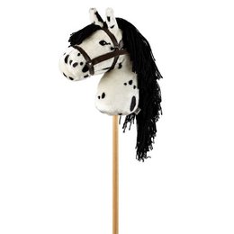 A wooden toy horse with a spotted black and white pattern, featuring a long black mane and tail. The horse is mounted on a wooden stick, making it a classic stick horse toy.