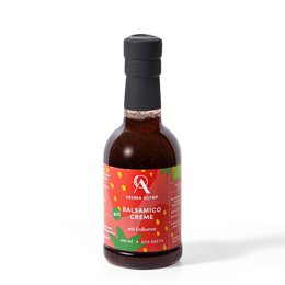 Organic balsamic cream with strawberries, 200 ml glass bottle and 500 ml plastic bottle. The product has a dark brown color and is surrounded by fresh strawberries.