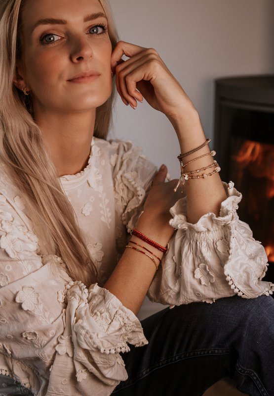 gold bracelet with red
