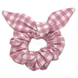 Pink gingham scrunchie with bow detail. Made of soft, stretchy fabric for comfortable wear.
