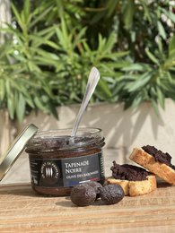 A savory black olive tapenade spread from France, made with high-quality olives, olive oil, and seasonings.