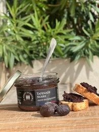 A savory black olive tapenade spread from France, made with high-quality olives, olive oil, and seasonings.