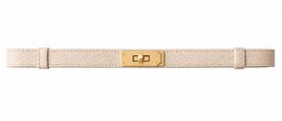 Canvas belt with gold buckle, available in multiple colors including beige, taupe, black, green, yellow, pink.