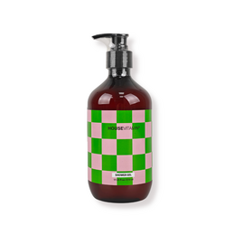Dark glass pump bottle with green and white checkered pattern, vegan shower gel, cucumber scent.