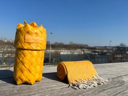 A long, rectangular scarf in a vibrant yellow color with a woven texture, suitable for men's fashion.