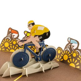 A pop-up card featuring a cyclist riding a bicycle against a backdrop of sunflowers.