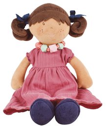 Soft, plush doll with brown hair in pigtails, wearing a pink dress with a floral pattern.