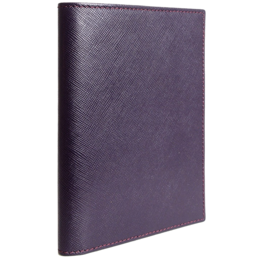A burgundy-colored leather passport sleeve with a textured saffiano pattern.