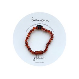 A bracelet made of round amber-colored beads, suitable for babies and children. Available in cognac, dark cognac, honey, and multi-colored variants.