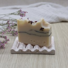 Decorative soap tray made of ribbed marble in an earthy terra color, with a natural, handcrafted appearance.