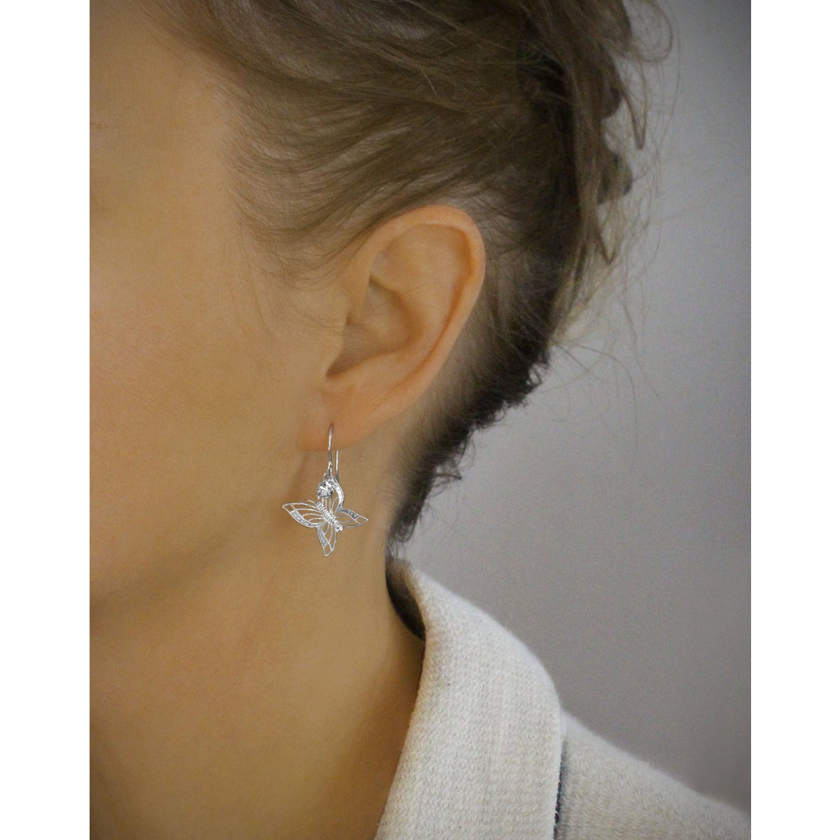 Rhodium plated butterfly earrings with charms