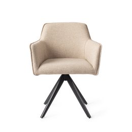 Beige upholstered dining chair with black swivel base. Comfortable armchair design with curved backrest and seat. Suitable for modern dining rooms or home offices.