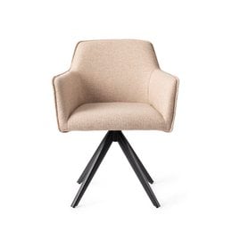 Beige upholstered dining chair with black swivel base. Comfortable armchair design with curved backrest and seat. Suitable for modern dining rooms or home offices.