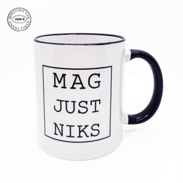 A white ceramic mug with the text "MAG JUST NIKS" printed on it in black. The mug has a simple, minimalist design.