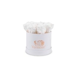 Preserved white roses in a white box. The roses have a delicate, natural appearance and are suitable for decorative purposes.
