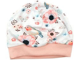 A soft, cozy baby hat featuring a delicate floral and bird print in shades of white, pink, and blue. The hat has a comfortable stretch fit and is perfect for keeping little ones warm and stylish.