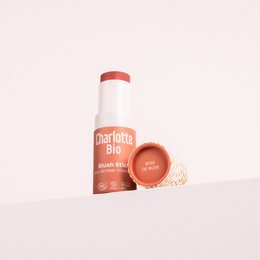 Pink blush stick, rose wood scent, cylindrical shape, natural organic makeup, warm rosy tone