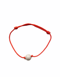 Beaded bracelet with a silver-colored beaded charm on a red cord.