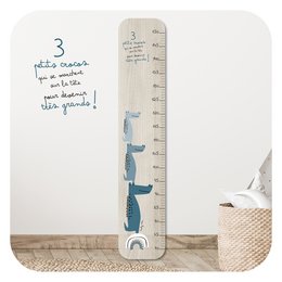 A tall, blue height gauge with a crocodile design, suitable for use in a child's room.