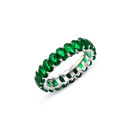 Emerald green wedding ring with oval-shaped stones in a continuous band design.