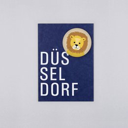 Magnet with postcard featuring a soccer ball design. The magnet has a black and white soccer ball graphic on a green background with text in German.