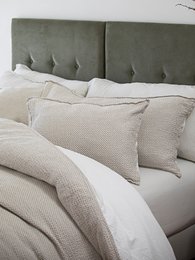 Waffle-textured duvet cover set in pearl or grey color, available in queen and king sizes, with a soft, cozy feel and modern, minimalist design.