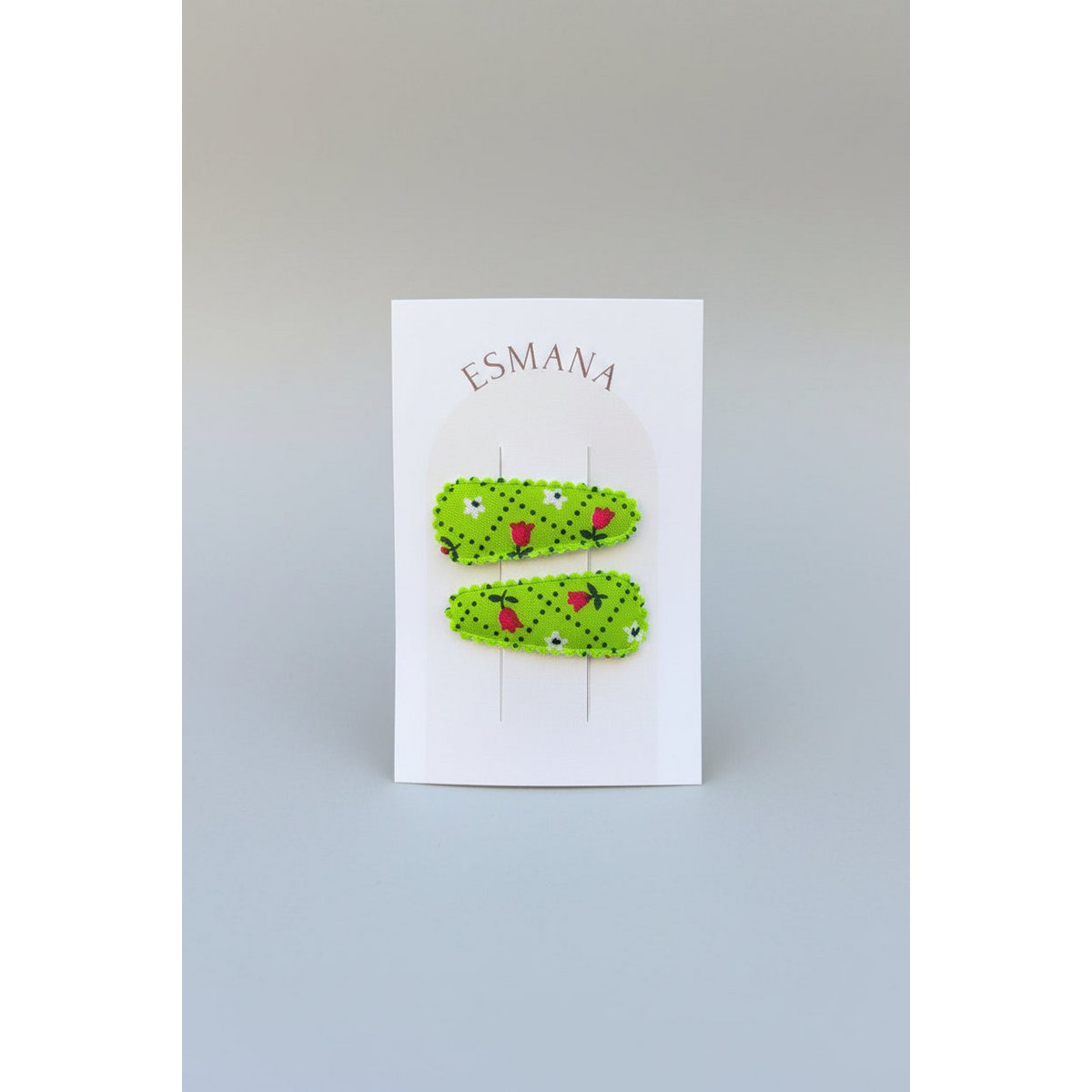 Baby klikspeld groen met kleine bloemetjes