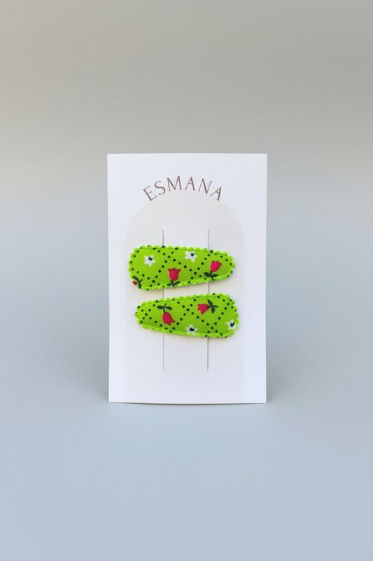 Baby klikspeld groen met kleine bloemetjes