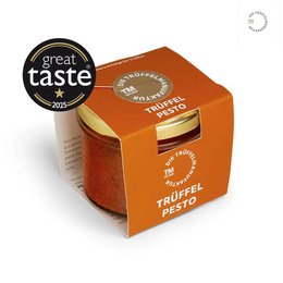 Truffle pesto pasta sauce in an orange square container with a label displaying the product name.
