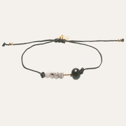 Black beaded bracelet with marble accents, adjustable cord closure.