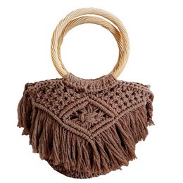 A brown macrame shopping bag with a round wooden handle and long fringed detailing. The bag has a textured, woven pattern and appears to be made of natural materials.