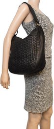 Black shoulder bag for ladies of braided leather - elegant design with both a short and long handle for versatile wearing comfort.