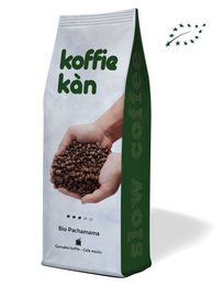 Organic coffee beans in a green and white package labeled "Koffie kan". The coffee beans appear to be freshly roasted with a rich, dark color.