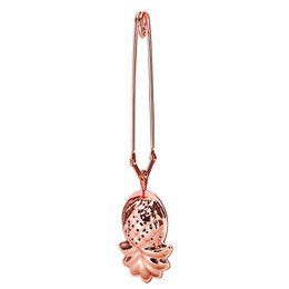 Rose gold tea tongs with pineapple-shaped infuser, ideal for steeping loose leaf tea.