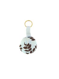 # Product Description

Light blue keychain with leaf pattern design, round smiley shape, gold ring attachment.