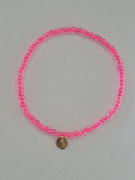A pink beaded bracelet with a small metal charm. The bracelet is made of small, round pink beads that are tightly woven together.