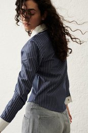  Dark blue and white striped women's blouse with long sleeves.