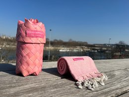 Warm light pink woven scarf with fringe details, suitable for men.