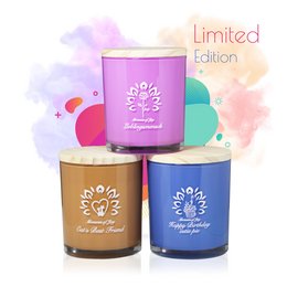 Scented candles in limited edition designs featuring floral patterns and text. Available in 3 variants: Happy Birthday, Lieblingsmensch, and Cat's Best Friend. Candles are round in shape with a wooden lid.