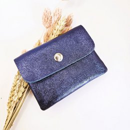 Dark blue mini wallet with snap closure and zipper compartment.