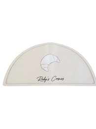 Beige silicone placemat, semicircle shape, croissant design, baby dining, text "Baby's Cuisine"