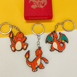  Wooden Arbok Pokémon keychain, custom geek anime gift, nerd video game fan. Purple snake-like Pokémon character with red eyes and fangs.