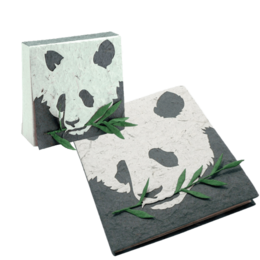 Panda-themed notebook and notepad set made from elephant dung, featuring a panda design with green leaves.