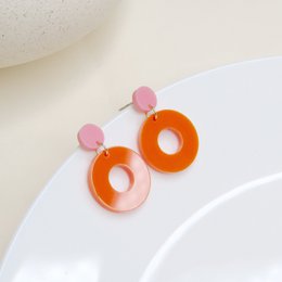 Colorblock Circle stud earrings in pink and orange