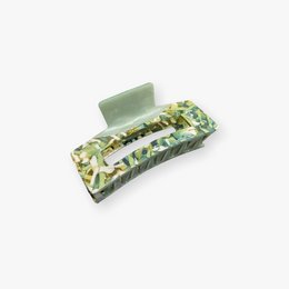 Rectangular green hair clip with floral pattern.
