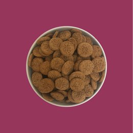 Bulk 2kg package of prune and honey biscuits for pets. Round, brown biscuits in a white container.
